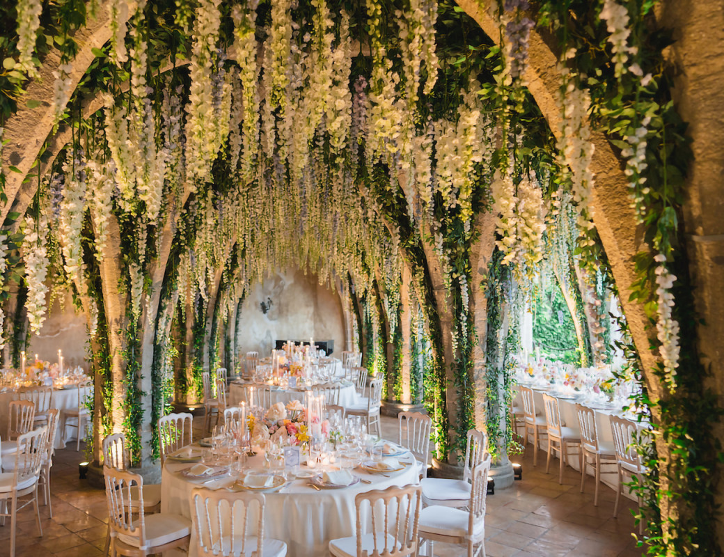 A grand soirée dinner beneath a cascade of wisteria